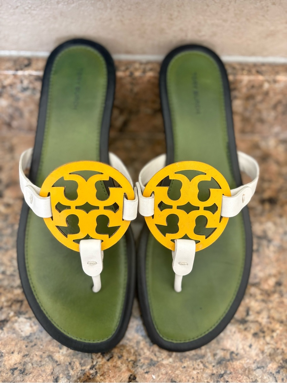Great condition - Women’s Tory Burch Miller Green & white w/ yellow logo.
